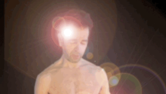 animated image zooming in on ind and then out to erect penis on naked coach - obscured by lens flare but erection shadow still visible to represent mind control over erection