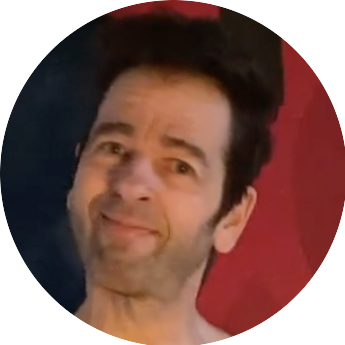 face of penisBuddy ErectionCoach smiling in a knowing way